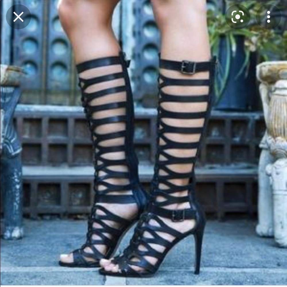 Shaft: 14" height, 13-3/4" circumference. 4" covered heel. Man-made sole.